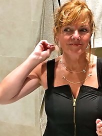 Mature cutie is fingering herself